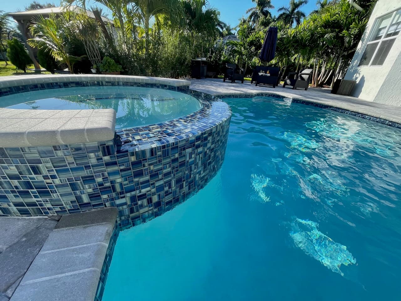 Pool water feature with tile work in South Florida