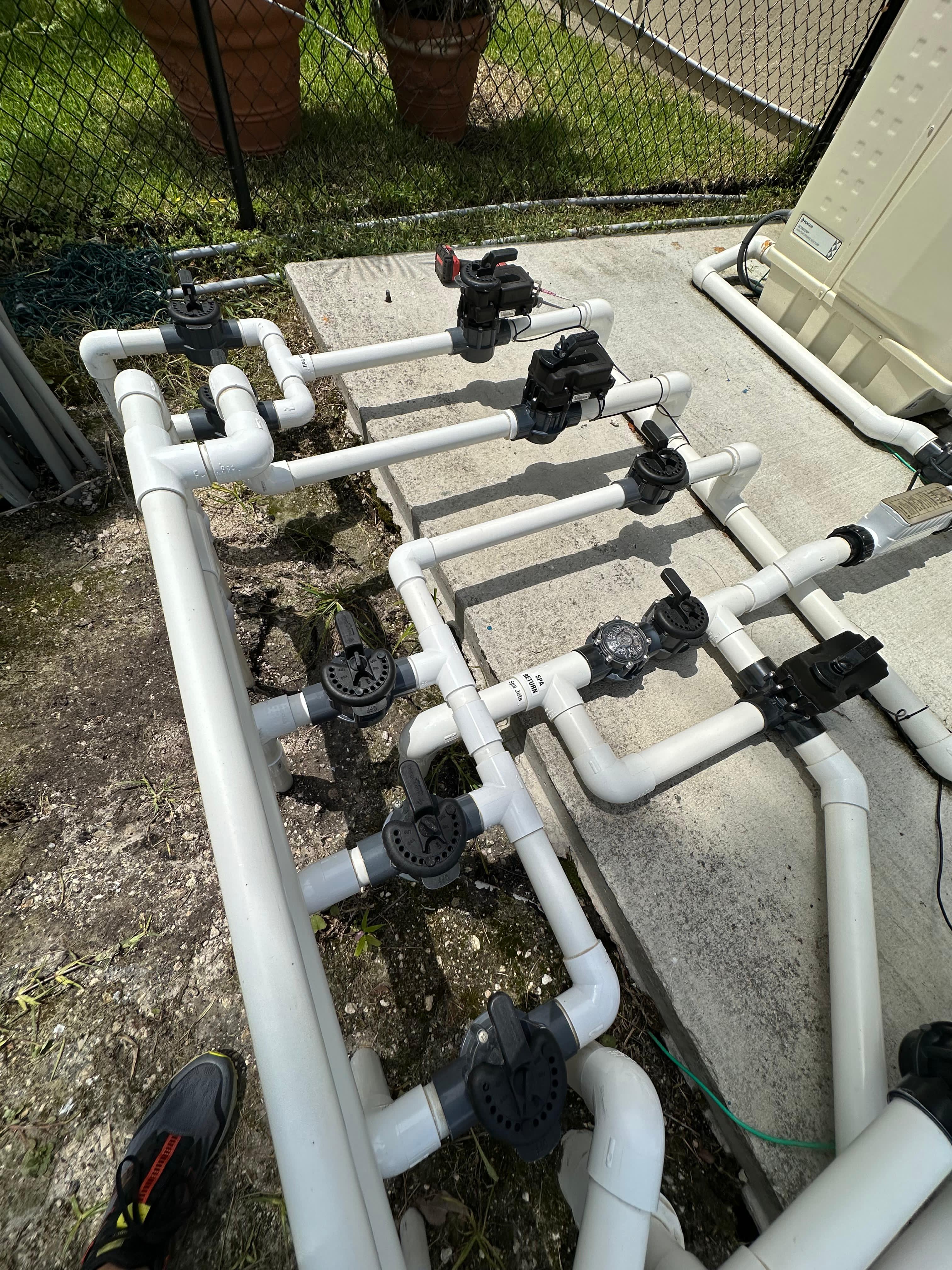 Pool plumbing system with valves and manifold configuration