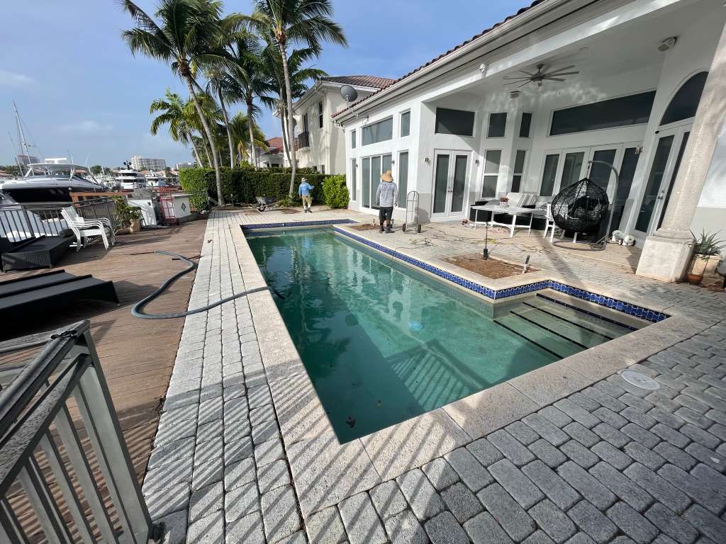 Waterfront pool with luxury paver deck