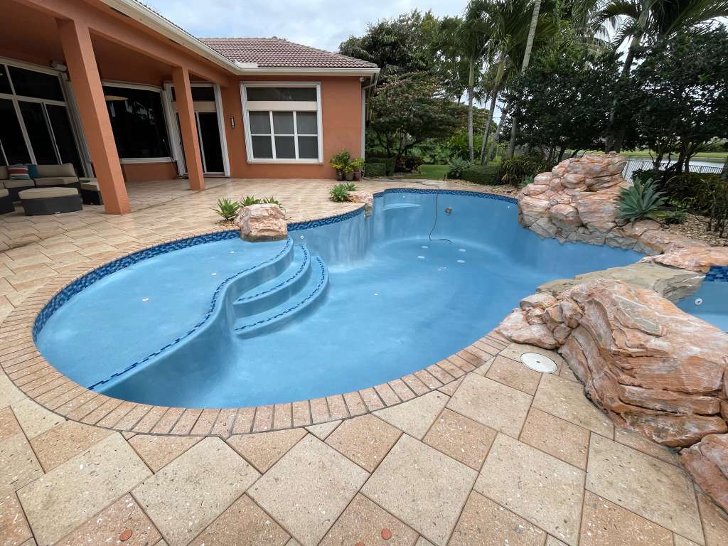 Spa with cascading rock waterfall